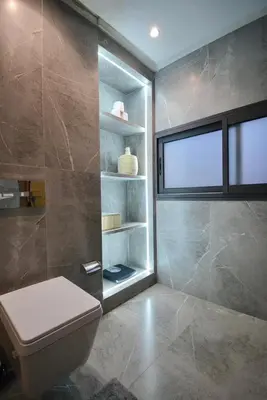 a bathroom with a toilet and a window at Hevernage penthouse in Marrakech
