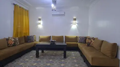 a living room with a couch and a coffee table at Appartement au cœur de centre ville in Marrakech