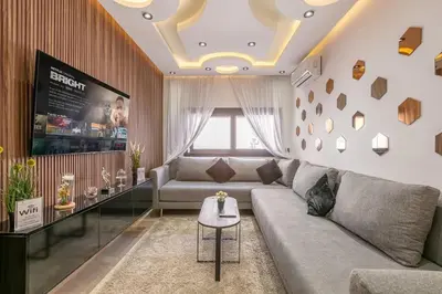 a living room with a couch and a table at Modern New Appartement Fully Equiped In Center of guéliz in Marrakech