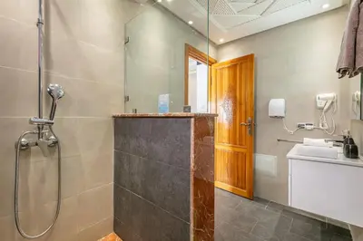 a bathroom with a shower and a sink at Modern New Appartement Fully Equiped In Center of guéliz in Marrakech