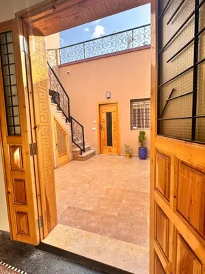 an open door of a building with a staircase at Square Appart in Marrakech