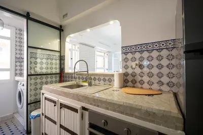a kitchen with a sink and a counter top at Élégant appartement avec terrasse au cœur Guéliz in Marrakech