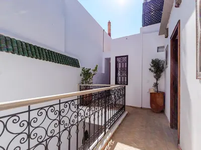a balcony of a house with a wrought iron railing at Riad Abati Piscine Privee avec Petit dejeuner et Terrasse in Marrakech