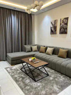 a living room with a couch and a coffee table at JASMINe in Marrakech
