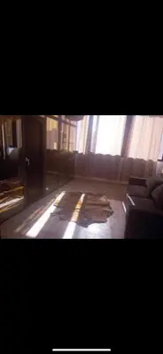 a living room with a couch and a window at Hostel GSK in Marrakech