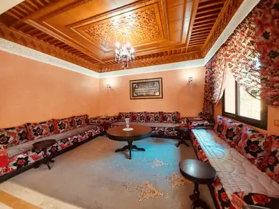 an overhead view of a waiting room with a table and chairs at Naoura House in Marrakech