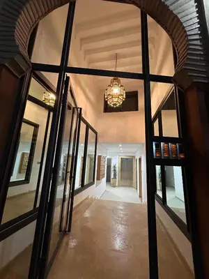 a hallway of a house with a large window at Appartement a Gueliz in Marrakech