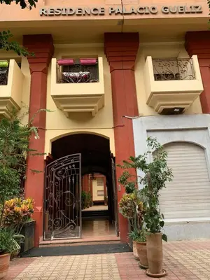 an entrance to a building with a black gate at Luxury Apartment in City Center of Marrakech in Marrakech