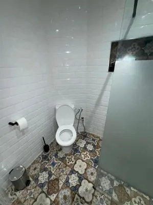 a bathroom with a white toilet in a room at Appt 10min pied jardin Majorelle in Marrakech