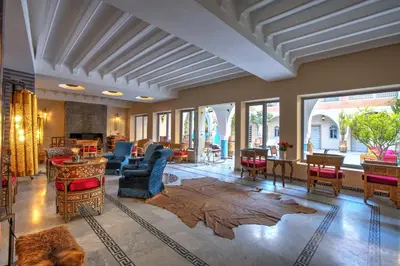 a living room with a couch and chairs and a table at Ksar Anika Boutique Hotel & Spa in Marrakech