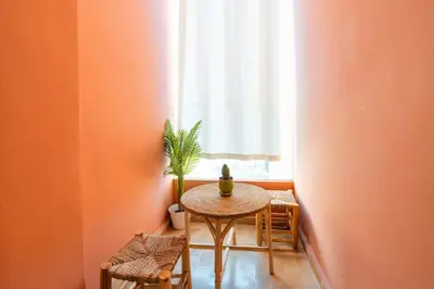 a small table in a room with a window at Luxury and Healthy designed Apartment with pool in Marrakech