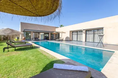 a swimming pool in the backyard of a house at Villa Relax in Marrakech