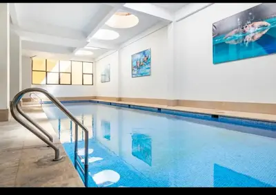 a large swimming pool with a blue swimming pooliterator at Résidence Miramas 2 - C5 in Marrakech