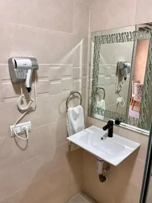 a bathroom with a sink and a mirror at Résidence Miramas 2 - C5 in Marrakech