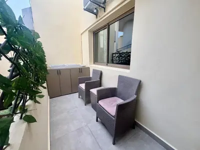 a row of chairs in a room with a window at Résidence Miramas 2 - C5 in Marrakech