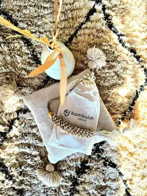 a christmas ornament with a bag and a vase at Dar Ou Bahssou in Marrakech