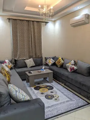 a living room with a couch and a table at Marrakech apartment in Marrakech