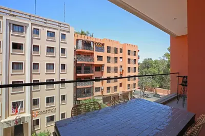 a view of a building from a balcony at Brand New and Stylish appart hotel Best location in Marrakech