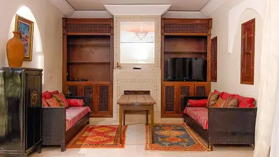 a living room with two couches and a table at Villa des Rêves in Marrakech