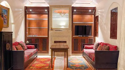 a living room with two couches and a table at Villa des Rêves in Marrakech