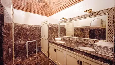 a bathroom with a sink and a mirror at Villa des Rêves in Marrakech