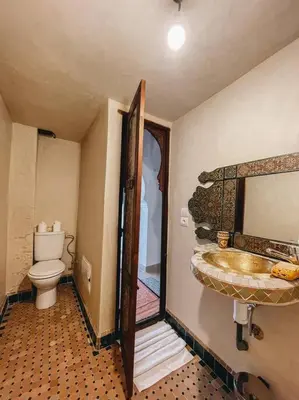 a bathroom with a sink and a toilet at Riad Dar Habiba 120m2 in der Medina mit Terrasse in Marrakech