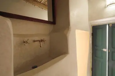 a bathroom with a sink and a mirror at Riad Haloma 90m2 in der Medina mit Terrasse in Marrakech