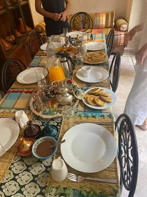 a table with plates of food on top of it at Riad Saadaoui in Marrakech