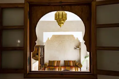 a view of a living room through a window at Riad Saadaoui in Marrakech