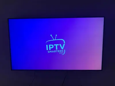 a tv screen with a blue and purple background at Luxury Appartement with Pool in Marrakech
