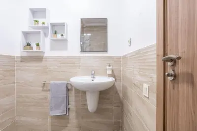 a bathroom with a white sink and a mirror at Spacious 2 BR FLAT with Wi-Fi, Pool and Parking in Marrakech