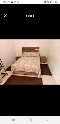 a small bedroom with a bed with a sqor at Marrakech in Marrakech