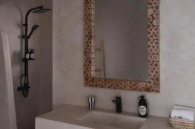 a bathroom with a sink and a mirror at Riad Soulmate in Marrakech
