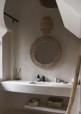 a bathroom with a sink and a mirror on the wall at Riad Soulmate in Marrakech