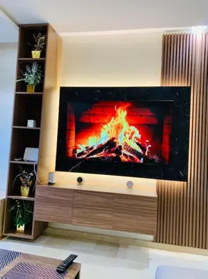 a living room with a fire in a fireplace at Expérience luxueuse Golf Prestigia Saphir BY KECH in Marrakech