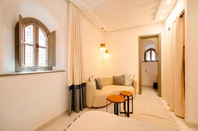 a living room with a couch and a window at Door Janna in Marrakech