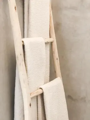 a wooden ladder with towels on it at Riad Dar-K in Marrakech