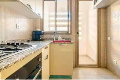 a kitchen with a sink and a stove at Appartement calme et élégant au coeur de Marrakech in Marrakech