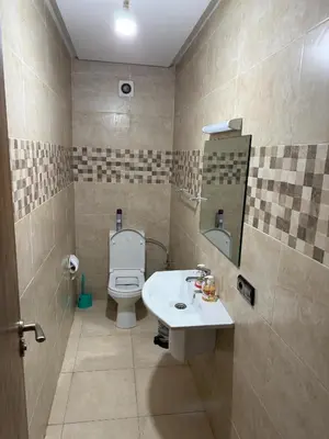 a bathroom with a toilet and a sink at Appartement Nour 5 Marrakech in Marrakech