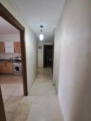 a hallway leading to a kitchen in a house at Appartement Nour 5 Marrakech in Marrakech