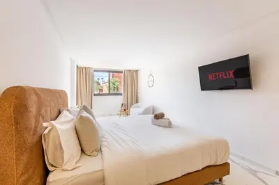 a bedroom with a bed with a teddy bear on it at New Duplex Haut Standing à Victor Hugo, Gueliz in Marrakech