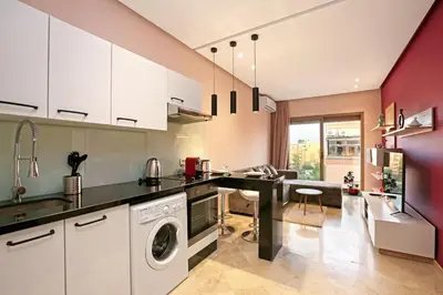 a kitchen with a washer and dryer at Elegant and Brand new appart in hypercenter of Marrakech in Marrakech
