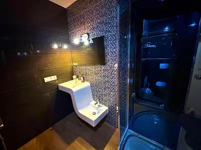 a bathroom with a sink and a mirror at Villa des Ocres - Élégance et Luxe à 15 min du centre ! in Marrakech