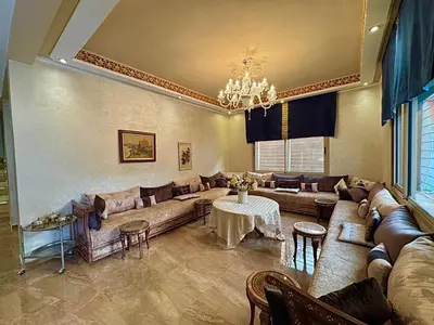 a large living room with couches and a table at Villa des Ocres - Élégance et Luxe à 15 min du centre ! in Marrakech