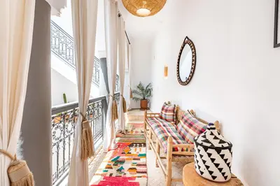 a living room with a couch and a rug at Riad Belvi - Breakfast - 10mn Jemaa El Fnaa-Pool in Marrakech