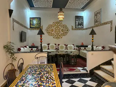 a living room with a couch and a table at M-S Riad in Marrakech