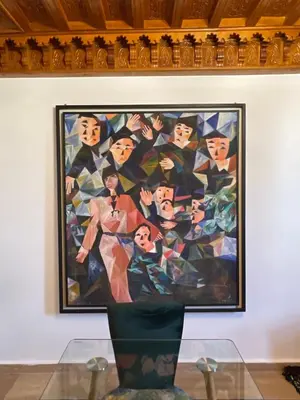 a painting on a wall with a glass table at Refined apartment DOWNTOWN in Marrakech