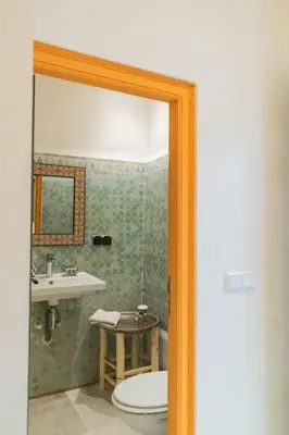 a bathroom with a toilet and a sink at Riad Pistache 135m2 in der Medina mit Terrasse in Marrakech