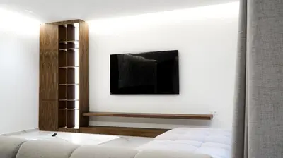 a living room with a tv and a couch at VILLA Atlas in Sraghna