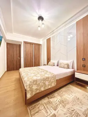 a bedroom with a large bed in a room at Appartement Sofia in Marrakech
